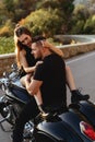 Couple of lovers kissing and hugging on motorbike Royalty Free Stock Photo