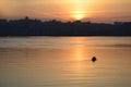 a couple of lovers ride a boat at a beautiful sunset