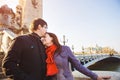 Couple of lovers on Seine river in Paris. travel in spring in Europe