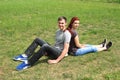 Couple of lovers sitting on meadow Royalty Free Stock Photo