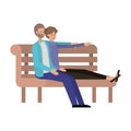 Couple lovers sitting on wooden chair