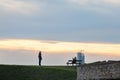 Couple, lovers, tourists taking pictures and posing in the Kalemegdan fortress park with a panorama of the skyscraper