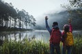 Couple lovers travel Beatiful nature at Pang ung lake and pine forest at Mae Hong Son in Thailand Royalty Free Stock Photo