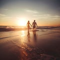 Couple of lovers walking inside water on tropical beach in summer vacation at sunset Love, travel and landscape concept Royalty Free Stock Photo