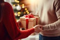 Couple lovingly giving each other gifts on Christmas Eve close up Royalty Free Stock Photo