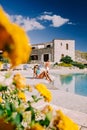 Couple on luxury vacation relaxing by the pool at an Agriturismo in Sicily Italy