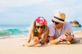 Couple lying on the beach and using mobile phones Royalty Free Stock Photo