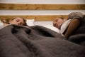 Couple lying in a bed and sleeping Royalty Free Stock Photo