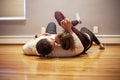 Couple lying on empty floor of new home Royalty Free Stock Photo