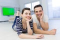 Couple lying on the floor at home Royalty Free Stock Photo