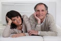 Couple lying on a futon Royalty Free Stock Photo