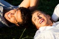 Couple lying on meadow in the sunshine Royalty Free Stock Photo