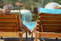 Couple lying by pool Royalty Free Stock Photo