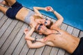 Couple lying by the pool Royalty Free Stock Photo