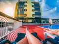 Couple lying on sun loungers next to the pool and having a rest Royalty Free Stock Photo