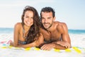 Couple lying on a towel at the beach Royalty Free Stock Photo