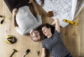 Couple lying on wooden floor Royalty Free Stock Photo