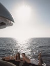 Couple Lying On Yacht's Edge