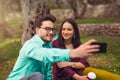 Couple make selfi under the olive tree