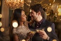 Couple Make Toast At Camera As They Celebrate At Party