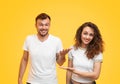 Couple making apologetic gesture