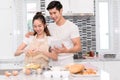 Couple making bakery, cake in kitchen room, Young asian man and woman Royalty Free Stock Photo