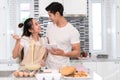 Couple making bakery, cake in kitchen room, Young asian man and woman together Royalty Free Stock Photo