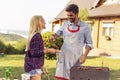 Couple making barbecue Royalty Free Stock Photo