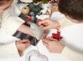 Couple making decorations for Valentine`s day, recover damaged heart, top view - romantic and love concept Royalty Free Stock Photo