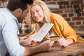 young happy couple making e-shopping with tablet