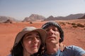 Couple making a selfie photo in the desert