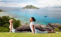 Couple making yoga cobra pose outdoors Royalty Free Stock Photo