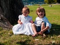 Couple of male and female children in green meadow portrait Royalty Free Stock Photo