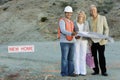 Couple With Male Foreman At Construction Site Royalty Free Stock Photo