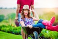 Couple with man giving woman ride in wheelbarrow