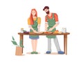 Couple man and woman cooks pizza together at table Royalty Free Stock Photo