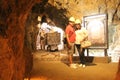 Couple man and woman explore a silver mine in the city of Zacatecas Mexico with yellow helmets enjoy their weekend vacations walki