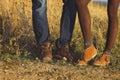 Couple man and woman feet in love romantic outdoor with autumn s