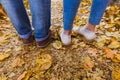 Couple man and woman Feet in Trendy outfits standing outdoor lifestyle with autumn nature on background Royalty Free Stock Photo