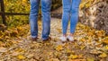 Couple man and woman Feet in Trendy outfits standing outdoor lifestyle with autumn nature on background Royalty Free Stock Photo