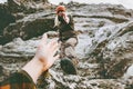 Couple Man and Woman help giving hands climbing mountains Love and Travel Lifestyle concept. Young family hiking adventure Royalty Free Stock Photo