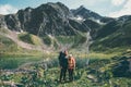 Couple Man and Woman hiking together at mountains Love and Travel Lifestyle