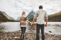 Couple man and woman holding hands enjoying mountains and lake view Royalty Free Stock Photo