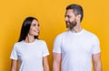 Couple of man and woman isolated on yellow. Family couple relationship. Millennial man and woman wearing white tshirt