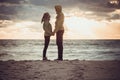 Couple Man and Woman in Love standing on Beach seaside