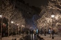 Couple, man and woman, lovers, walking at night on obilicev venac street in stari grad, belgrade, surrounded by snow, in winter
