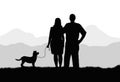 a couple, man and woman outdoors accompanied by their dog