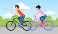 Couple of man and woman are riding a bicycle