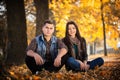 Couple man and woman sitting in the park Royalty Free Stock Photo