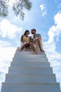 couple man and woman on stairway in the sky, Ladder Way to Heaven isolated on sky Royalty Free Stock Photo